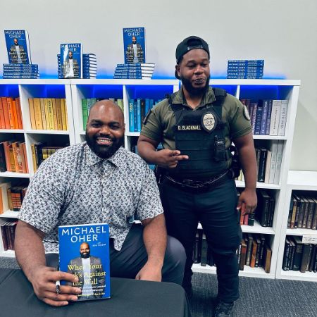 Michael Oher was photographed at this book signing event.
